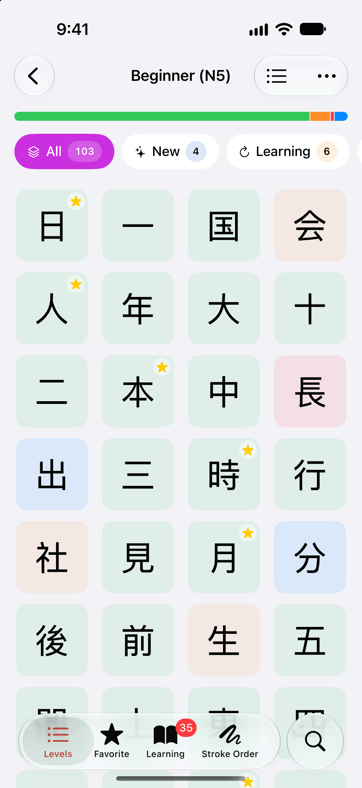 Beginner (N5) on iPhone as a grid of kanji tiles, four to a row, starting 日, 一, 国, 会. Above the grid are a progress bar and the filters All 103, New 4 and Learning 6. Most tiles are tinted green; a few are orange, two are blue and one is red, and some carry a star.